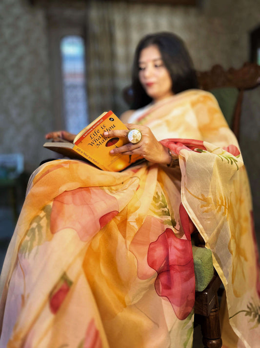 High quality designer premium chiffon saree handmade using natural dye and matching blouse in floral print in peach orange colour online shopping india