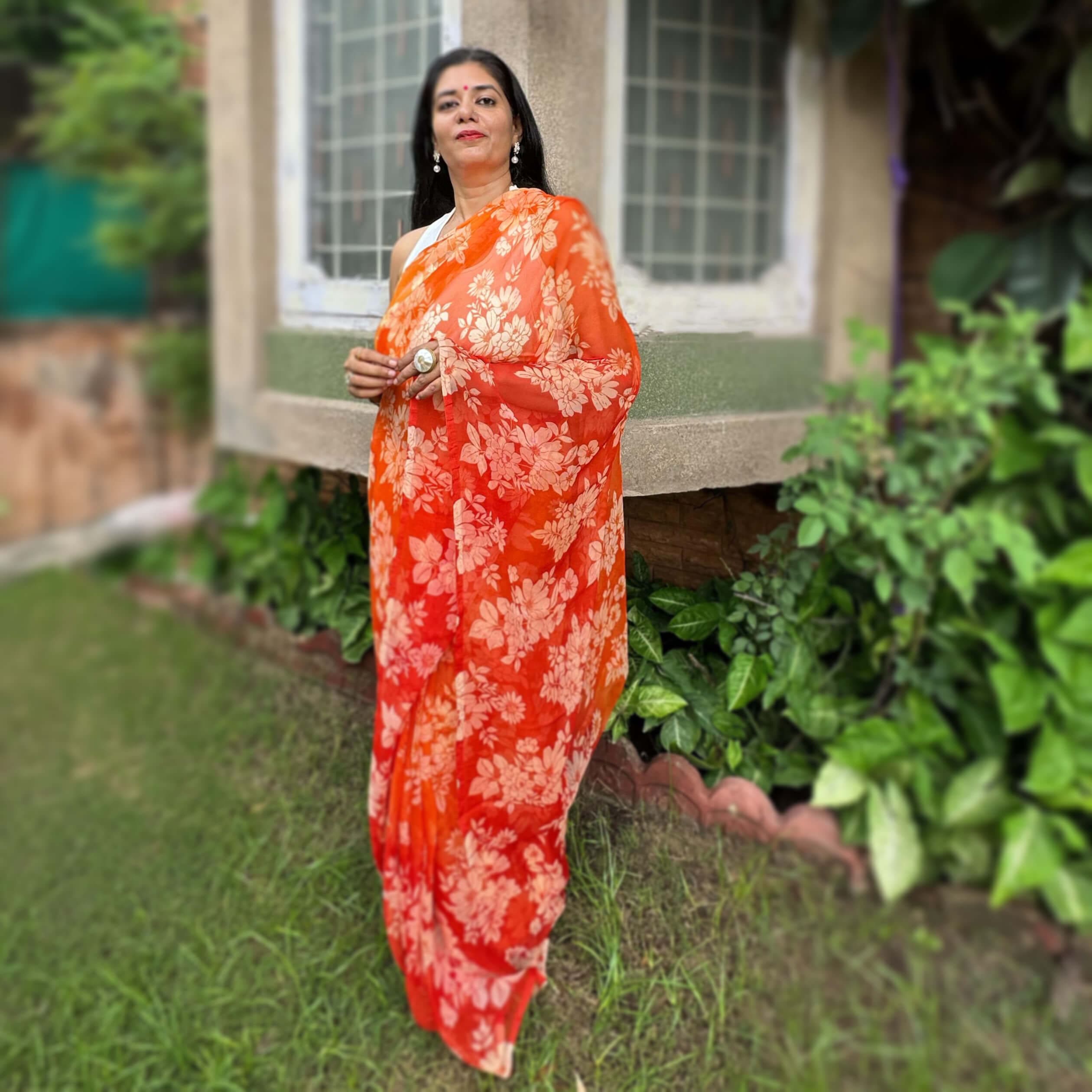 High quality designer premium chiffon saree handmade using natural dye and matching blouse in floral jaal print in orange colour online shopping india