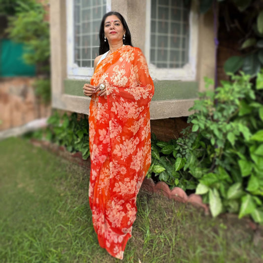 High quality designer premium chiffon saree handmade using natural dye and matching blouse in floral jaal print in orange colour online shopping india