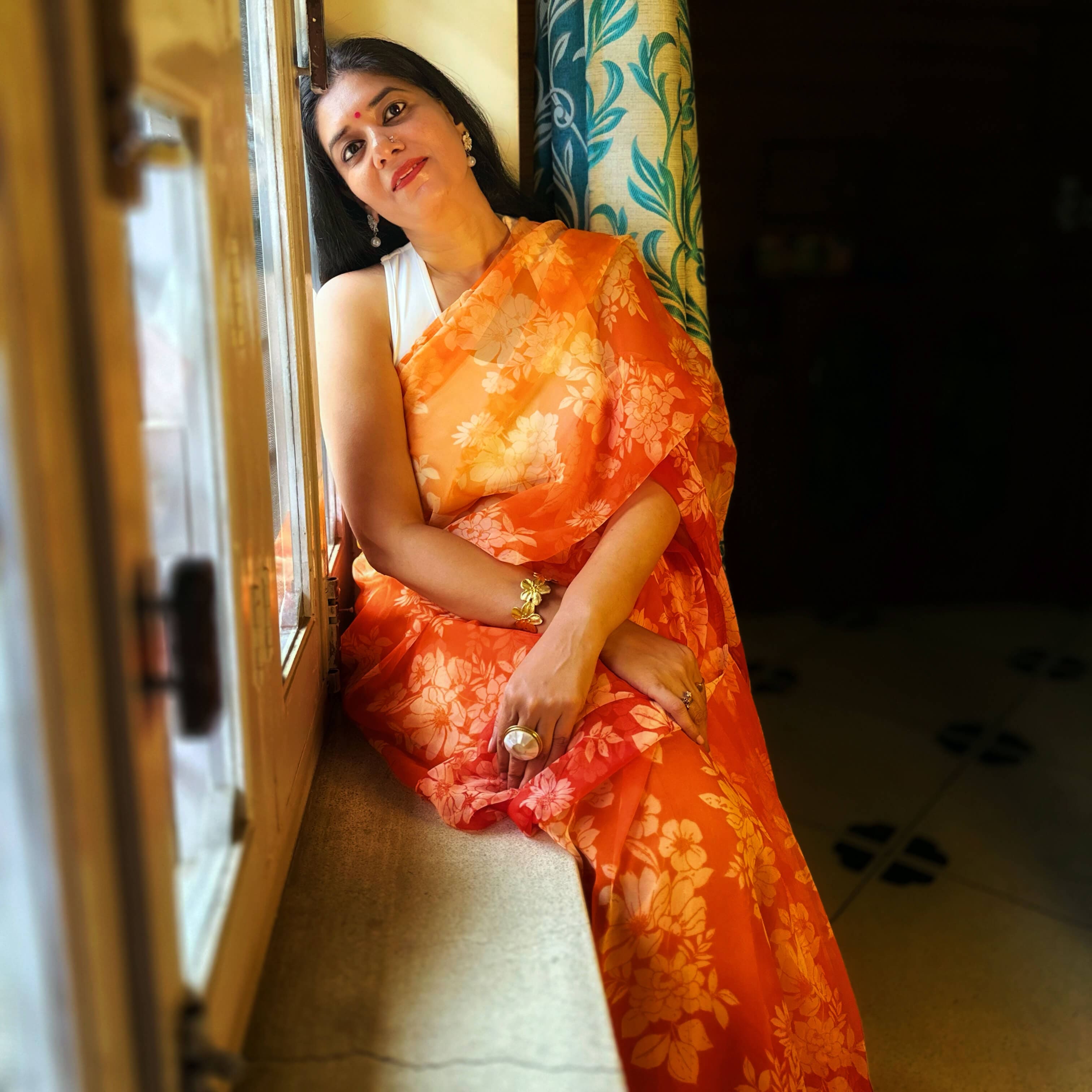 High quality designer premium chiffon saree handmade using natural dye and matching blouse in floral jaal print in orange colour online shopping india