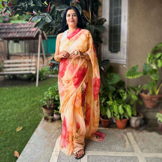 High quality designer premium chiffon saree handmade using natural dye and matching blouse in floral print in peach orange colour online shopping india