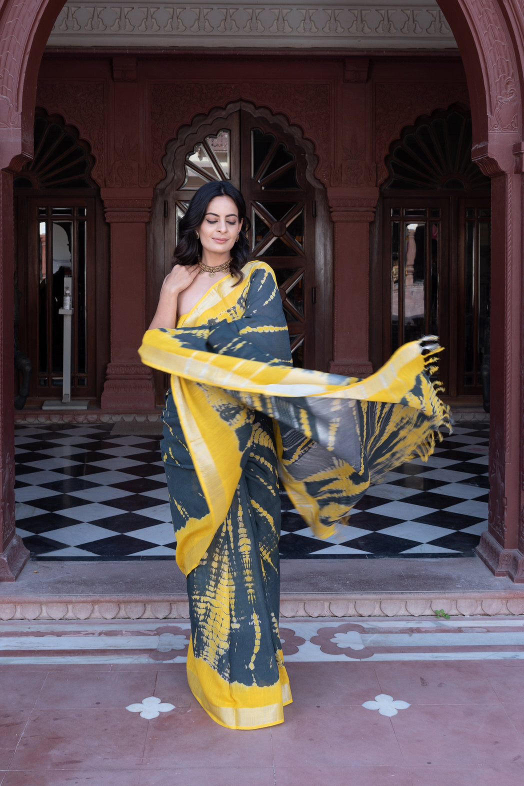 Sustainable fashion shibori linen saree and blouse using organic dye in yellow and black for online shopping made in India